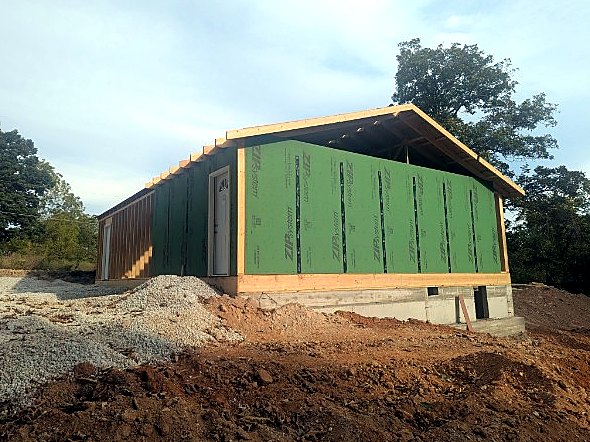 End wall sheathed above the foundation